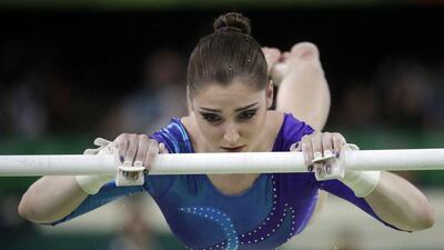 Russia’s Aliya Mustafina performs on the uneven bars during the women’s gymnastics individual all-around final at the 2016 Rio Olympics at Rio Olympic Arena on August 11, 2016 in Rio de Janeiro, Brazil. Julio Cortez / AP Photo