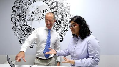 Ross Bethell, director of strategy at PR firm Cicero & Bernay, with intern Disha Dadlani at his office in Dubai. Satish Kumar / The National