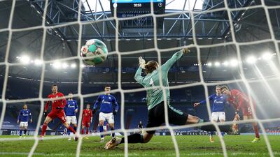 Thomas Muller finishes past Schalke goalkeeper Ralf Fahrmann to open the scoring. EPA