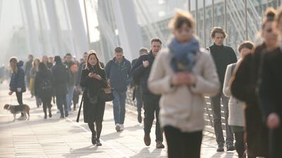 Commuters crossing the Golden Jubilee Bridge in London by foot during the strike. PA
