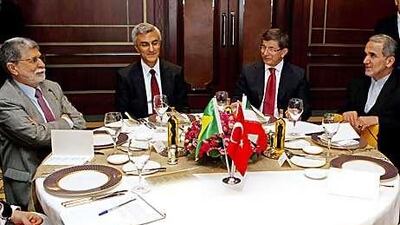 (From left) Brazil's Foreign Minister Celso Amorim, Turkish deputy secretary Engin Soysal, Turkey's Foreign Minister Ahmet Davutoglu and Iranian deputy secretary Mehdi Akhoundzadeh pose before their meeting in Istanbul.