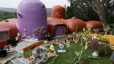 The San Francisco Bay Area suburb of Hillsborough argued the home's owner installed dangerous steps, dinosaurs and other Flintstone-era figurines without necessary permits. AP
