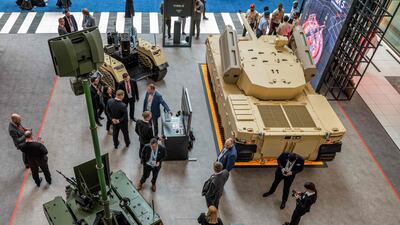 Visitors view the Type-X robotic combat vehicle (RCV) at the Edge pavilion. AFP