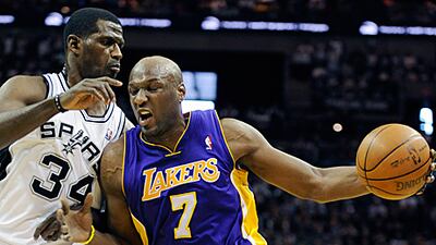 Lamar Odom, right, drives against Spurs forward Antonio McDyess during the LA Lakers win in San Antonio.