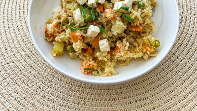 One of the lunch offerings prepared on-site is the vegan biriyani, served with dehydrated carrots as a snack. Photo: Jason Von Berg / The National