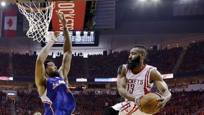 Rockets guard James Harden (13) looks to pass around Los Angeles Clippers center DeAndre Jordan. David J. Phillip / AP Photo