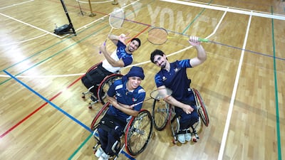 UAE badminton para athletes Jamal Al Bedwawi, left, Siham Al Rushaidi, centre, and Omair Muhammad take a break from training at the Dubai Club for People of Determination. Victor Besa / The National