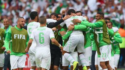 Abdelmoumene Djabou of Algeria celebrates scoring his team's third goal with teammates during their match against South Korea on Sunday at the 2014 World Cup. Quinn Rooney / Getty Images