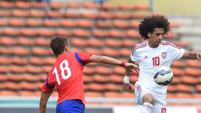 Omar Abdulrahman, right, in action during the UAE's friendly against South Korea at Shah Alam Stadium in Kuala Lumpur on July 11, 2015. Courtesy UAE FA