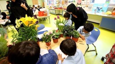 Teachers have found that children become more engaged in their lessons when their parents are in the classroom, such as this lesson in how plants grow at the Mubarak bin Mohammed School in Abu Dhabi. Fatima Al Marzooqi / The National