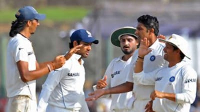 The Indian cricket captain, Anil Kumble, second right, is congratulated by teammates after the dismissal of Sri Lanka's Nuwan Kulasekera.