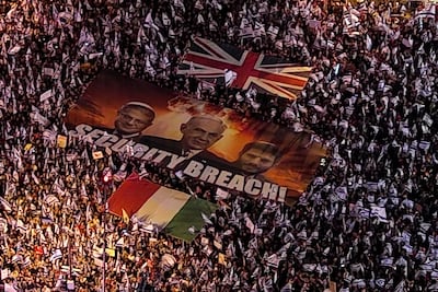 A banner depicting Israeli Prime Minister Benjamin Netanyahu, Security Minister Itamar Ben-Gvir and Finance Minister Bezalel Smotrich in Tel Aviv. Reuters