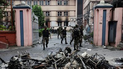 Nepali Army soldiers patrol near the Supreme Court during a curfew. It followed demonstrations led by young people angry about the blocking of several social media sites. Police opened fire on the crowds, killing 19 people. Reuters