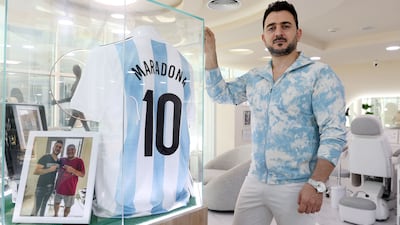 Barber Mohamed Mir Ebrahim, who cut Diego Maradona's hair, at his shop in Business Bay, Dubai. Chris Whiteoak / The National