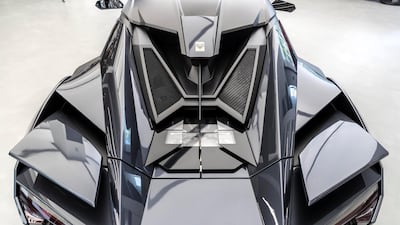 Two flaps either side of an self-raising spoiler automatically adjust according to speed. Antonie Robertson / The National