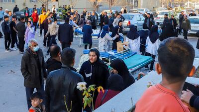 Medical staff attend to those injured in the blast as they arrive at Kerman hospital. AP