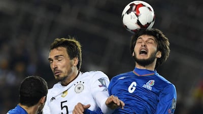 Germany's Mats Hummels, left, and Azerbaijan's Badavi Huseynov vie for the ball during the2018 World Cup qualification match in Baku on March 26, 2017. Kirill Kudryavtsev / AFP