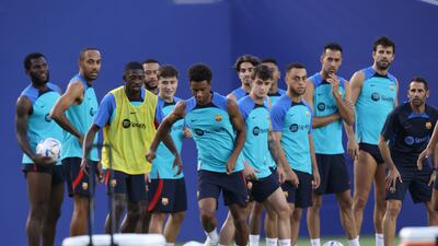Barcelona players warm up during a training session. Getty