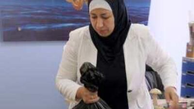 An Al Jazeera worker packs equipment after the station's operation in the West Bank city of Ramallah was shut down.