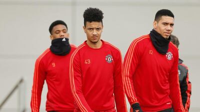 Manchester United’s Anthony Martial, Cameron Borthwick Jackson and Chris Smalling arrive for training. Action Images via Reuters / Jason Cairnduff