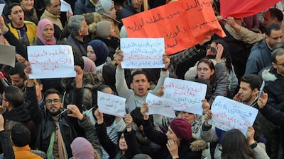 Tunisians take part in a rally marking the ninth anniversary of the 2011 uprising, at Habib Bourguiba Avenue in Tunis on January 14, 2020. (Photo by FETHI BELAID / AFP)