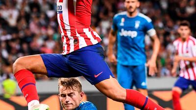 Juventus' defender Matthijs De Ligt vies with Atletico Madrid's forward Joao Felix. AFP