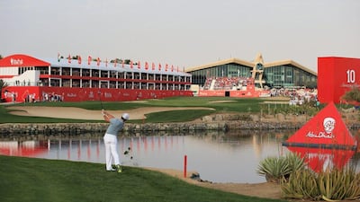 Rory McIlroy hits his approach into 18 during his third round on Saturday. The world No1 will tee off at 11:55 on Sunday's final round. Matthew Lewis/Getty Images