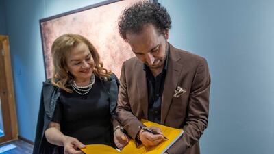 Shamma signs his book A Vision and a Life: Forty Years of Colours, which chronicles his diverse artistry spanning four decades