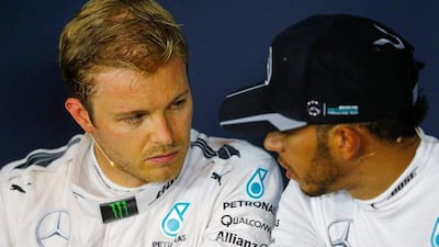 Mercedes teammates Nico Rosberg and Lewis Hamilton look at each other during a news conference. Dominic Ebenbichler / Reuters / July 2, 2016