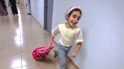 A young pupil heads to the nursery area