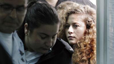 Palestinian teenager Ahed Tamimi arrives for the start of her trial in an Israeli military court at Ofer military prison in the occupied West Bank village of Betunia on February 13, 2018. Thomas Coex / AFP