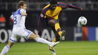 Dynamo Kiev's Oleksandr Aliyev, left, and Arsenal's Kolo Toure in action.