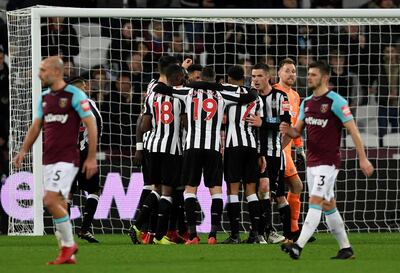 Newcastle United players celebrate after the match. Tony O'Brien / Reuters