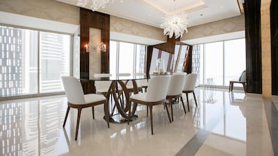 Floor-to-ceiling windows allow the natural light to flood throughout the penthouse. Courtesy Luxhabitat