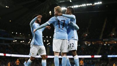 Kevin De Bruyne, Kelechi Iheanacho and Raheem Sterling celebrate during their team’s League Cup win on Tuesday to reach the semi-finals. Phil Noble / Reuters