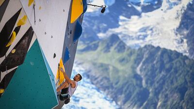 Slovenia's Milan Preskar competes in the semi-finals of the men's lead competition of the IFSC Climbing World Cup on Mont-Blanc square in Chamonix, French Alps, on July 9, 2022. (Photo by OLIVIER CHASSIGNOLE / AFP)