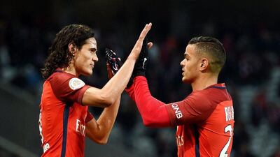 Edinson Cavani, left, scored the only goal of the game as Paris Saint-Germain edged Lille on Friday night. Francois Lo Presti / AFP
