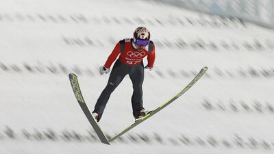 Taku Takeuchi of Japan in action during the training session for the ski Jumping event at the RusSki Gorki Jumping Centre at the Sochi 2014 Winter Olympics in Krasnaya Polyana on Sunday. Valdrin Xhemaj / EPA