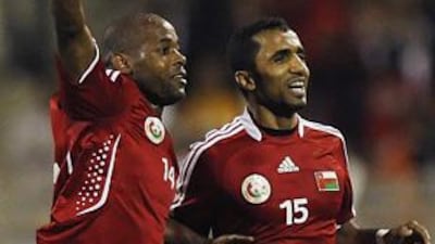 Rabea, left, celebrates his opener with Ismail al-Ajmi.