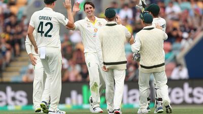Australia bowler Pat Cummins celebrates after taking the wicket of England's Dawid Malan for 25. Getty