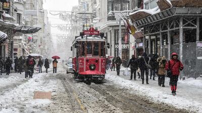 Istiklal Avenue after snowfalls in Istanbul. A snowstorm brought the city to a standstill after nearly 40cm fell overnight. Yasin Akgul / AFP