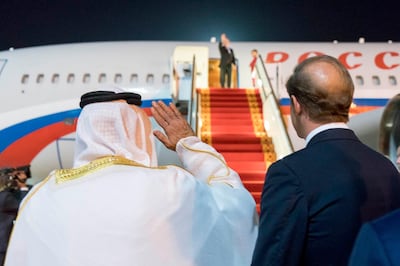 Sheikh Mohamed bin Zayed waves goodbye to Russian President Vladimir Putin in Abu Dhabi.