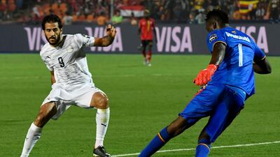 Egypt forward Marwan Mohsen, right, challenges Uganda goalkeeper Robert Odongkara. AFP