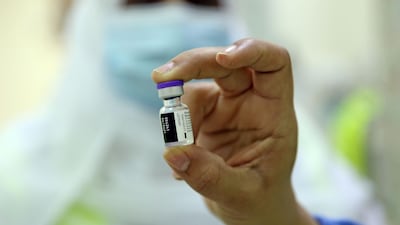 A healthcare worker prepares to administer the Pfizer-BioNTech Covid-19 vaccine in the Omani capital Muscat. AFP