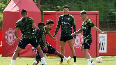 Manchester United's Cristiano Ronaldo and new signing Antony train with teammates at Carrington. Reuters