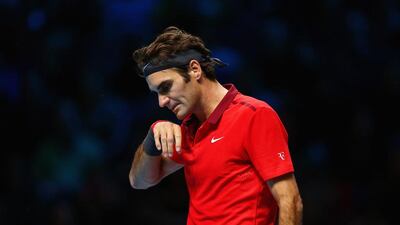 Roger Federer withdrew from the summit clash of the ATP World Tour Finals because of a back injury. Clive Brunskill / Getty Images