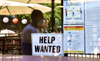 A sign outside a restaurant in Los Angeles, California. Unemployment has affected the young and the vulnerable more than other segments of society, the OECD says. AFP