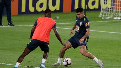 Roberto Firmino, right, training with Brazil in Abu Dhabi. Pawan Singh / The National