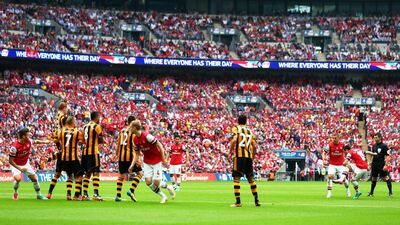 Santi Cazorla of Arsenal scores their first goal from a free kick against Hull City on Saturday to make it 2-1 at that point in the FA Cup final. Paul Gilham / Getty Images / May 17, 2014