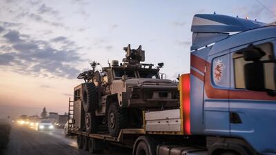 A convoy of U.S. armored military vehicles leave Syria on a road to Iraq in Sheikhan, Iraq. Refugees fleeing the Turkish incursion into Syria arrived in Northern Iraq since the conflict began, with many saying they paid to be smuggled through the Syrian border. Getty Images